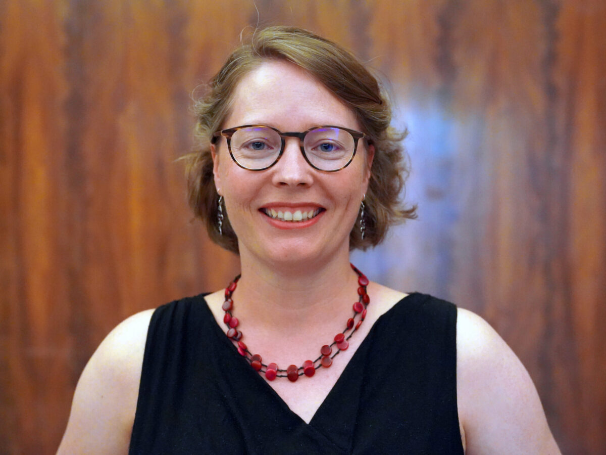 Headshot of Yvonne Maier, Physical Lab associate teaching artist, wearing a necklace and black dress